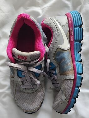 Nike Women's Gray Sneakers with Pink Lining and Blue Accents